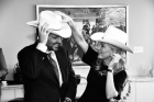 Prince Hussain and Princess Fareen trying on cowboy hats in Calgary 